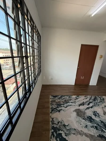 Room features: large windows with black frames, white painted walls, wood laminate flooring, area rug with abstract pattern, single wooden door, ceiling light fixture; style: modern; view: city.