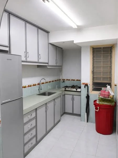 Kitchen features: grey cabinetry, light green countertop, stainless-steel fridge, single-bowl stainless-steel sink, chrome pull-down faucet, 4-burner gas hob, wall-mounted exhaust hood, white tiled backsplash, white tiled flooring, window with metal grille, red trash bin, kitchen utensils on countertop; style: modern.