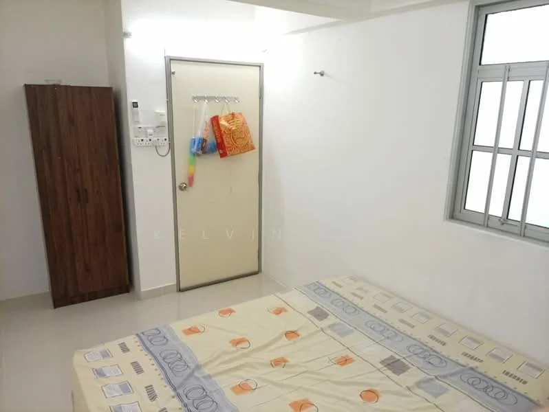 Bedroom features: single bed with patterned bedding, wooden wardrobe, white painted walls, tile flooring, window with metal grille, door with handle, hanging storage bags on door, light ceiling.