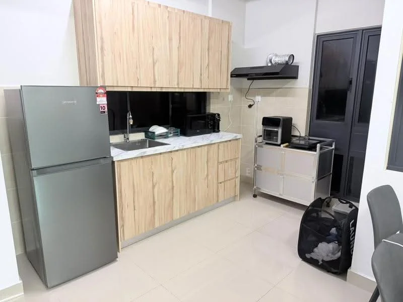 Kitchen features: stainless-steel fridge, built-in microwave, black countertop with white veining, wood cabinetry with light wood finish, black kitchen hood, ceramic tile flooring, wall-mounted storage unit, sink with faucet, small kitchen appliance (toaster or similar), laundry basket; style: modern.