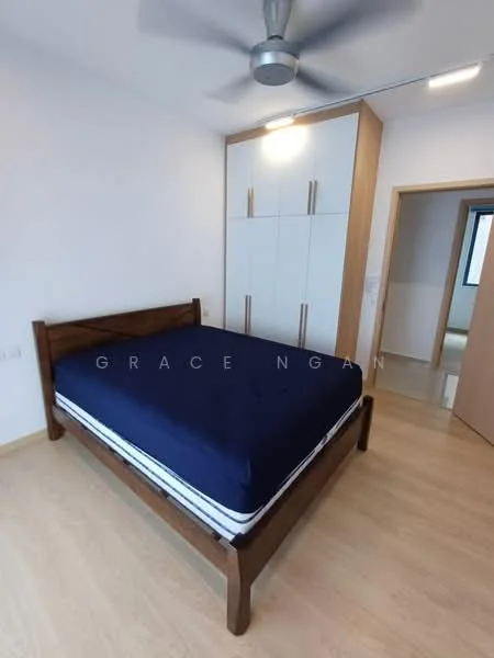 Bedroom features: king-size bed with blue bedding, wooden bed frame, built-in wardrobe with white doors and wooden handles, light wood flooring, ceiling fan, white painted walls, window with natural light, door leading to hallway; style: modern.