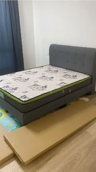 Bedroom features: queen-size bed, upholstered headboard in grey, mattress with patterned cover, wooden flooring, blue curtains, decorative wall, bed frame with storage, area rug, cardboard boxes on floor; style: modern.