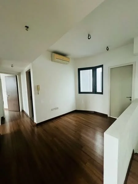 Room features: wooden flooring, white painted walls, recessed ceiling lights, wall-mounted split AC, corner window, door leading to another room, door leading to hallway; style: modern.