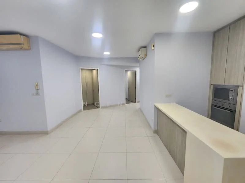 Room features: light grey painted walls, white ceiling, recessed downlights, wall-mounted split AC, cream tiled flooring, kitchen island with countertop, built-in oven, microwave, doorway leading to hallway, doorway leading to other rooms; style: modern.