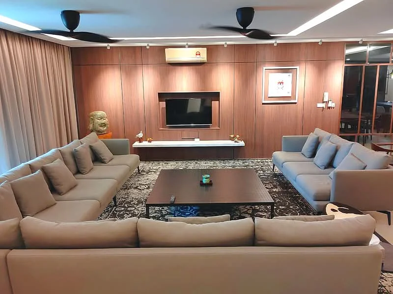 Living features: L-shape sectional sofa in beige, coffee table, wall-mounted TV, wood panel feature wall, recessed downlights, 2 ceiling fans, decorative wall art, area rug with intricate pattern, curtains, decorative sculpture, wooden flooring; style: modern.