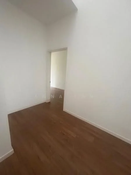 Room features: white painted walls, wooden flooring, doorway leading to another room, natural light from adjacent room.