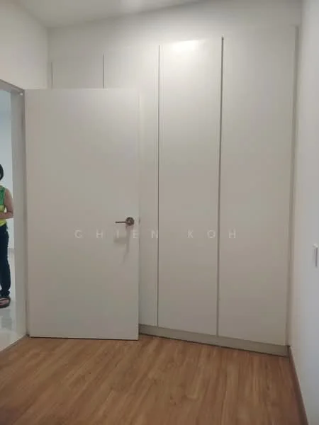 Room features: white painted walls, laminate flooring, built-in wardrobe with sliding doors, door with round handle, light switch, corner design of wardrobe.