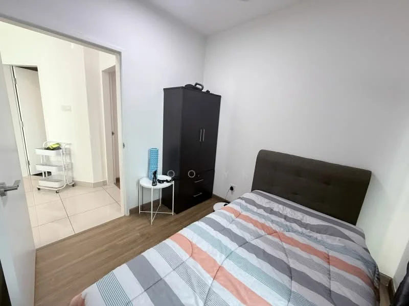 Bedroom features: queen-size bed with grey upholstered headboard, striped bedding in grey, orange, and blue, wooden flooring, white painted walls, built-in wardrobe with dark finish, small white side table, blue decorative item on side table, doorway leading to hallway, tile flooring visible in hallway; style: modern.