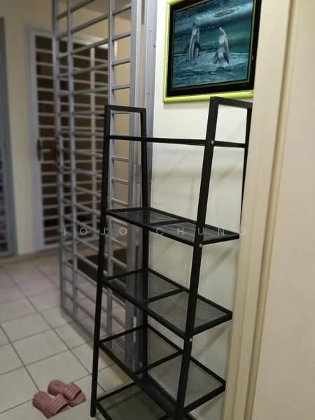 Room features: metal shelving unit with black finish, four open shelves, framed artwork with a picture of penguins, cream painted walls, tiled flooring, slippers in pink color, metal security grille door, door frame; style: modern.