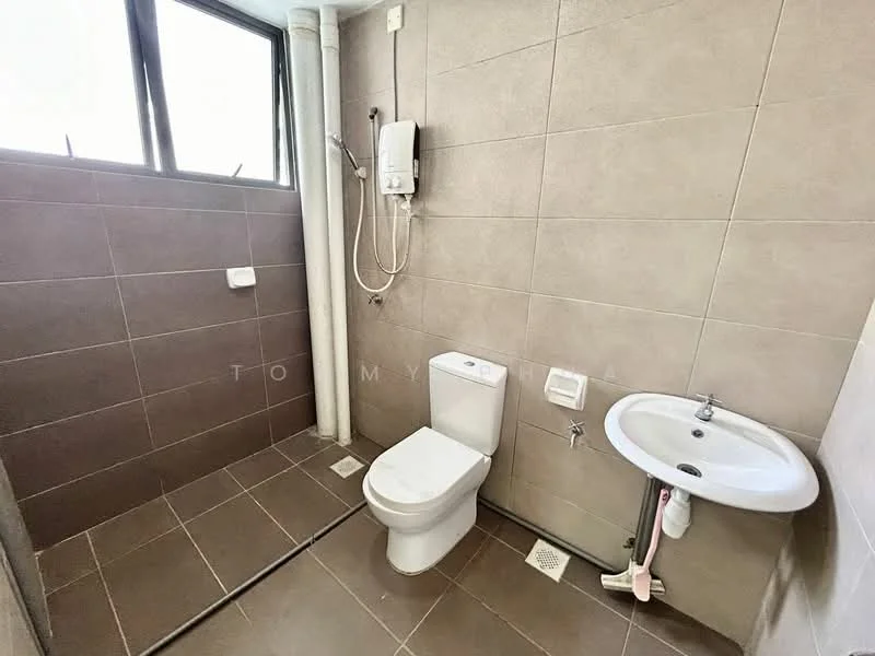 Bathroom features: grey tiled walls, light grey tiled flooring, one-piece toilet, wall-mounted basin with chrome faucet, shower area with handheld shower, water heater unit, window for natural light, toilet paper holder, drainage grate; style: modern.