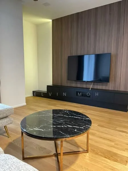 Living features: wood flooring, dark wood feature wall, wall-mounted TV, black TV console, round coffee table with black marble top, gold metal legs on coffee table, sofa with light fabric upholstery, recessed lighting; style: modern.