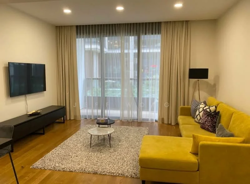 Living features: yellow fabric sofa, coffee table with round top, area rug with geometric pattern, wall-mounted TV, black TV console, floor lamp, curtains, wood flooring, large windows, indoor plants; style: modern; view: garden.