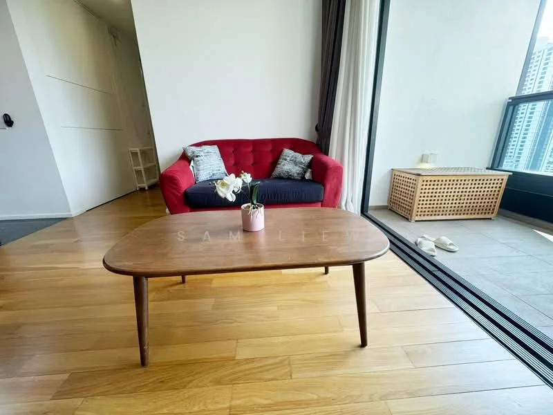 Living features: red fabric sofa, blue accent cushions, wooden coffee table, laminate flooring, floor-to-ceiling windows, curtains, decorative plant in vase, woven storage box, slippers on the floor; style: modern; view: city.