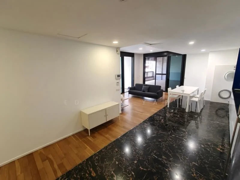 Living features: white painted walls, wood flooring, black marble countertop, sofa in dark color, dining table for six, white dining chairs, floor-to-ceiling windows, visible laundry machine; style: modern.