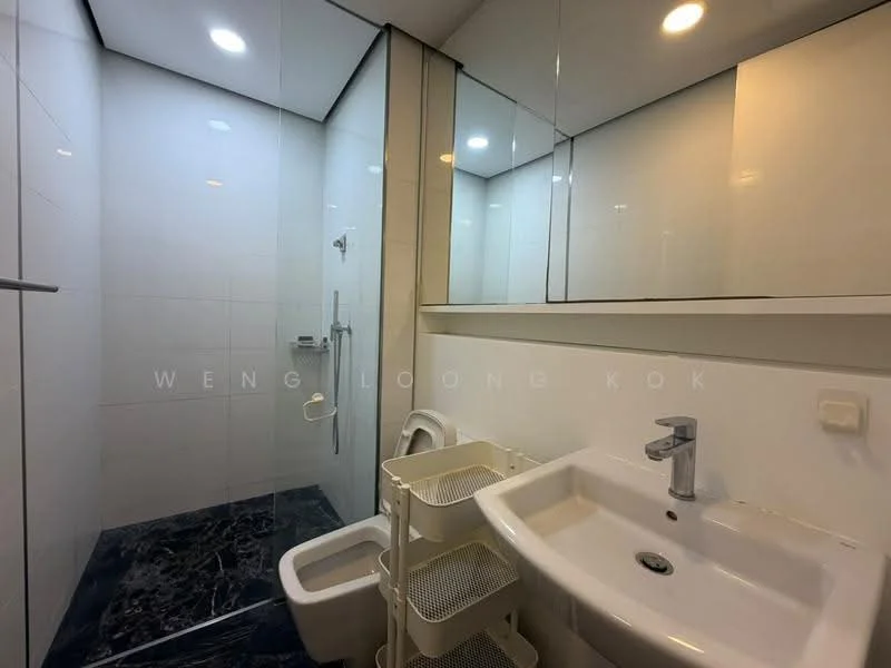 Bathroom features: white tiled walls, black marble flooring, walk-in shower with glass enclosure, chrome shower head, chrome basin mixer faucet, white sink, toilet, storage cart, recessed LED downlights, mirror, wall-mounted towel holder; style: modern.