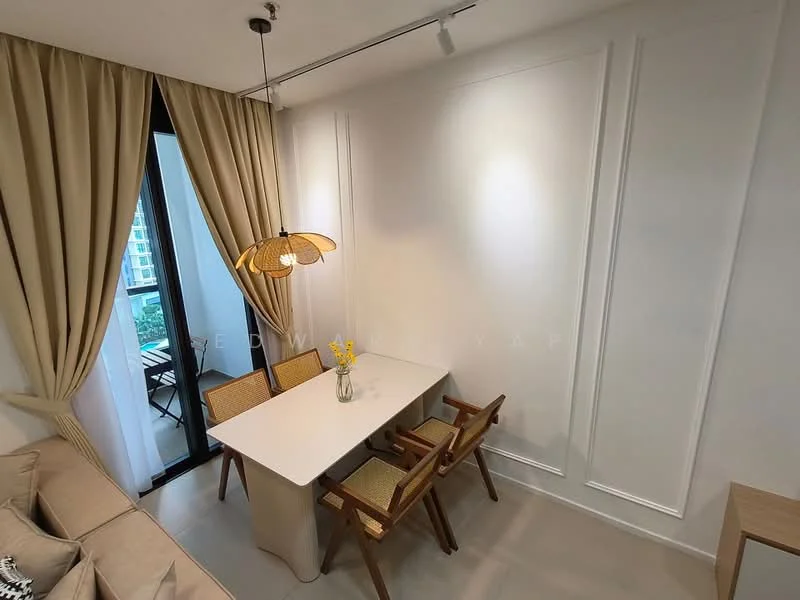 Dining features: white painted walls, light grey flooring, large window with sheer curtains, wooden dining table, 4 wooden chairs with woven seats, pendant light fixture, decorative vase with flowers, wall-mounted lighting, crown moulding; style: modern; view: garden.