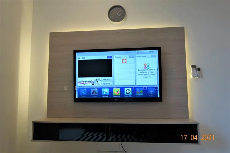 Living features: wall-mounted TV, wooden TV console, decorative wall clock, lighted wall panel, black shelving unit, neutral wall color, modern design; style: modern.