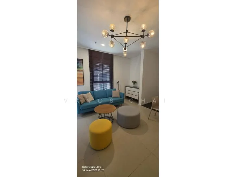 Living features: blue fabric sofa, yellow round ottoman, grey round ottoman, wooden side table, floor lamp, abstract artwork on wall, recessed lighting, chandelier with multiple bulbs, window with blinds, light-colored tiled flooring; style: modern.