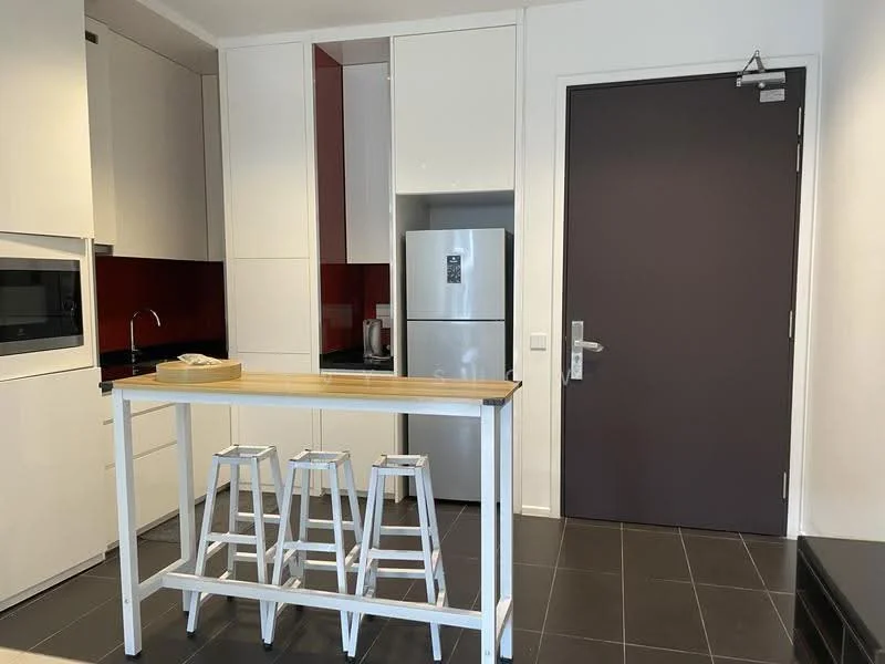 Kitchen features: white cabinetry, black countertop, stainless-steel fridge, built-in microwave, single-bowl stainless-steel sink, chrome pull-down faucet, red backsplash, 3 white bar stools, black tile flooring, wall-mounted kitchen cabinets, open shelving, kitchen island; style: modern.