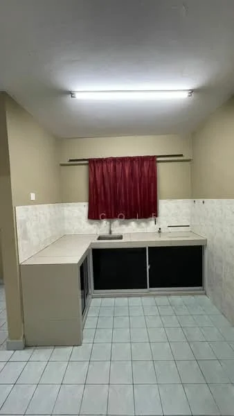 Kitchen features: L-shaped countertop, white laminate cabinetry, black glass cabinet doors, single-bowl stainless-steel sink, chrome faucet, white tiled backsplash, grey tiled flooring, red curtain, fluorescent ceiling light.