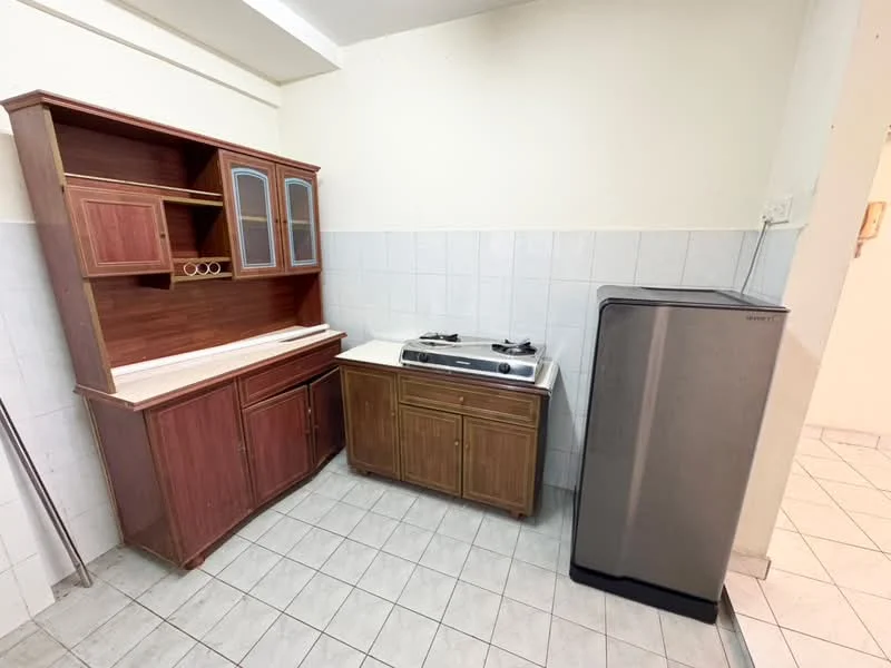 Kitchen features: wooden cabinetry with glass doors, white countertop, double-burner gas stove, stainless-steel fridge, white tiled walls, grey tiled flooring, open shelving, sink area.