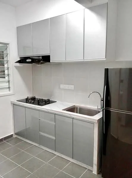 Kitchen features: grey cabinetry, stainless-steel sink, chrome pull-down faucet, black gas hob with two burners, built-in range hood, white tiled backsplash, white countertop, dark grey floor tiles, black refrigerator; style: modern.