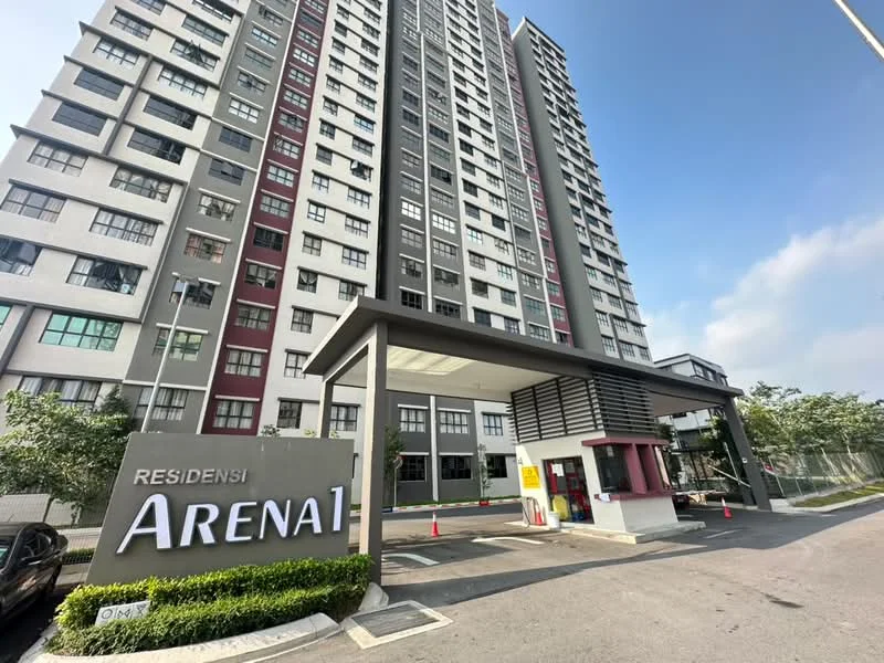 Exterior type: high-rise condominium; features: glass curtain wall, white painted facade, red accent panels, double-volume main lobby, porte cochère drop-off, security guard house at entrance, landscaped entrance with greenery, visible parking area; style: modern.
