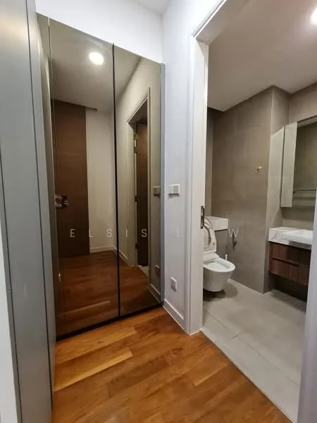 Bathroom features: light grey tile flooring, light grey wall tiles, wood cabinetry with sink, mirror above sink, toilet, shower area, recessed lighting, chrome faucet; style: modern. Room features: full-length mirrored wardrobe, wooden flooring, white painted walls, doorway to bathroom.