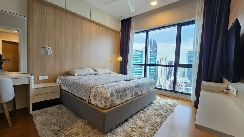 Bedroom features: king-size bed with patterned bedding, upholstered headboard, 2 bedside lamps, floor-to-ceiling windows, city skyline view, wooden flooring, white painted walls, ceiling fan, decorative pendant light, dressing table with mirror, built-in wardrobe, area rug with neutral color; style: modern; view: city.
