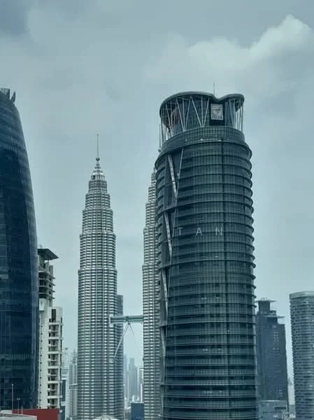 Exterior type: high-rise condominium; features: glass curtain wall, modern architectural design, prominent skyline presence, surrounded by urban landscape, visible city skyline in background; style: modern.