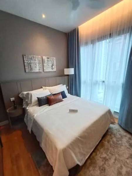 Bedroom features: queen-size bed with white bedding, upholstered headboard, two bedside tables, table lamp on bedside table, framed artwork on walls, floor-to-ceiling windows with sheer curtains, wooden flooring, area rug with neutral color, recessed ceiling lights, ceiling fan; style: modern; view: city.