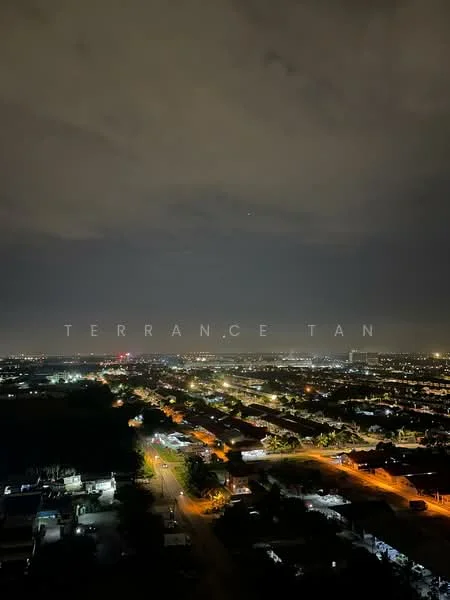Exterior features: nighttime city skyline, street lights visible, residential areas, urban landscape, cloudy sky, distant city lights.