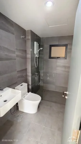 Bathroom features: grey tiled walls, grey tiled flooring, walk-in shower with glass enclosure, rain shower head, handheld shower, single-sink vanity with wall-mounted faucet, toilet, window for natural light, recessed downlights; style: modern.