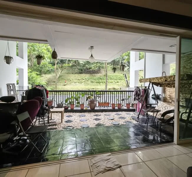 Balcony features: sliding glass door, black tiled flooring, white painted ceiling, hanging pendant lights, railings with black metal, potted plants, outdoor seating, swing chair, decorative stones on floor, greenery view; style: modern; view: garden.