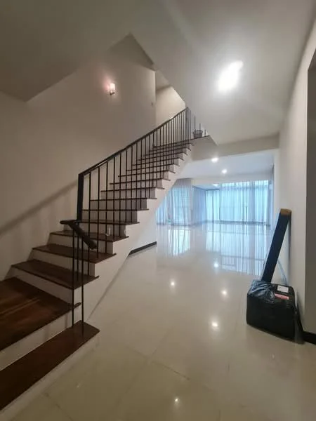Room features: staircase with wooden steps and metal railing, white painted walls, glossy marble flooring, large windows with sheer curtains, recessed ceiling lights, open space layout, corner with black storage box; style: modern.