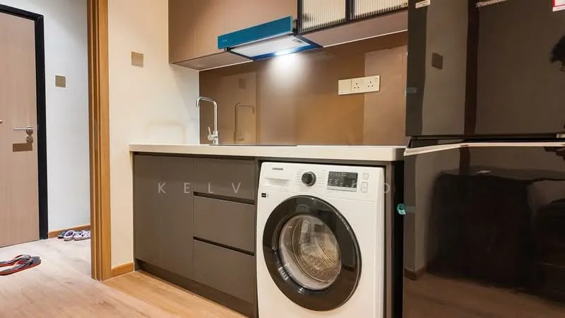 Laundry features: white front-load washing machine, black refrigerator, dark wood cabinetry, white countertop, stainless-steel sink, chrome pull-down faucet, under-cabinet lighting, light wood flooring; style: modern.
