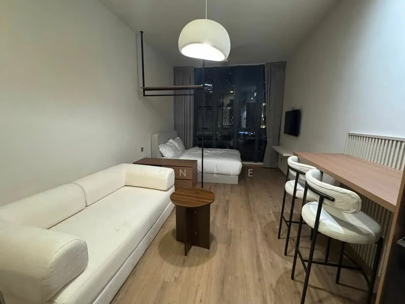 Living features: white fabric sofa, wooden coffee table, 2 high-back bar stools, wooden dining table, floor-to-ceiling windows, curtains, light wood flooring, pendant light fixture, wall-mounted TV; style: modern; view: city. Bedroom features: queen-size bed, white bedding, bedside table, wall-mounted light fixture; style: modern.