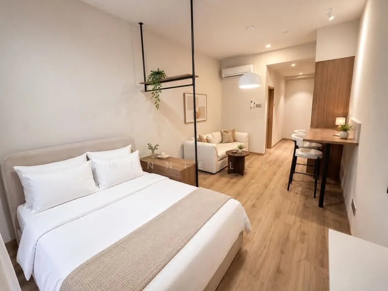 Bedroom features: queen-size bed with upholstered headboard, white bedding, light wood flooring, wall-mounted air conditioning unit, decorative wall art, bedside table, table lamp, open shelving unit, neutral painted walls, ceiling light fixture; style: modern. Living features: 2-seater fabric sofa in white, wooden coffee table, bar counter with stools, light wood cabinetry, neutral painted walls, ceiling light fixture; style: modern.