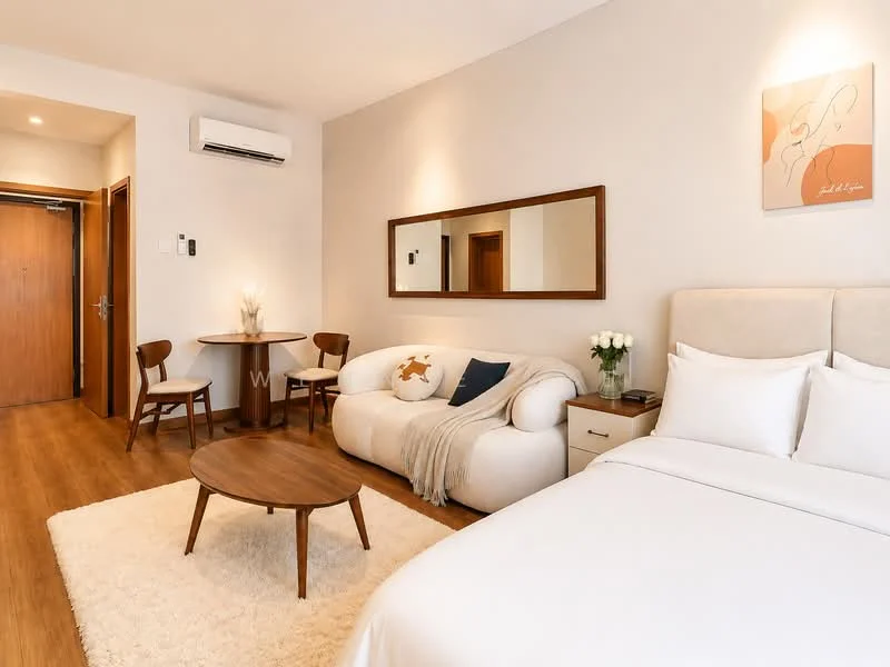 Living features: queen-size bed with white bedding, upholstered headboard, 3-seater fabric sofa in white, wooden coffee table, area rug with cream color, wall-mounted mirror, framed artwork on wall, wooden side table, 2 wooden dining chairs, dining table for 2, wall-mounted split AC, laminate flooring, white painted walls; style: modern.
