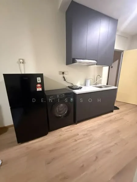 Kitchen features: black refrigerator, front-load washing machine, stainless-steel sink, chrome pull-down faucet, dark cabinetry, light wood flooring, wall-mounted electrical outlets, countertop space; style: modern.