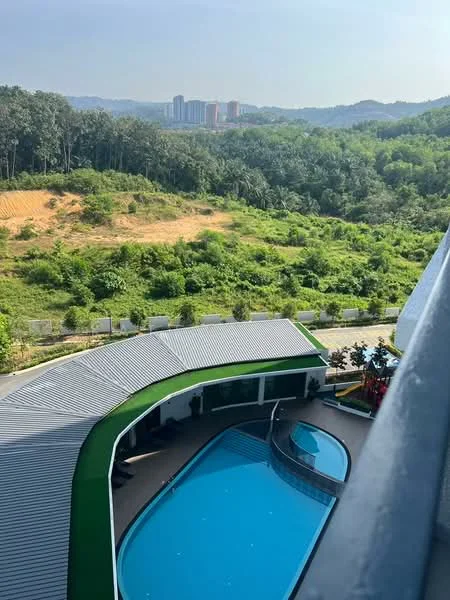 Exterior type: swimming pool deck; features: infinity pool, pool deck with loungers, landscaped garden, surrounded by greenery, view of distant buildings, manicured lawn, children's playground, outdoor dining area; style: modern.