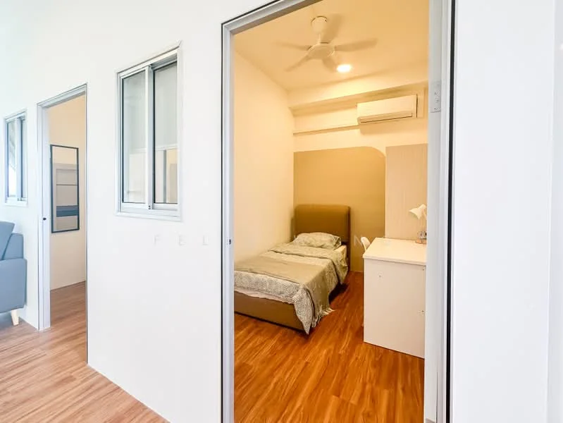 Bedroom features: single bed, upholstered headboard, bedside table, desk with lamp, ceiling fan, wall-mounted air conditioning unit, wooden flooring, white painted walls, window with grille; style: modern. Room features: grey sofa, white walls, wooden flooring, doorway leading to another room.