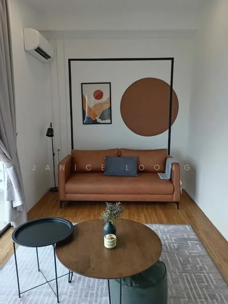 Living features: 3-seater leather sofa in brown, decorative throw pillow, round coffee table with black top, area rug with geometric pattern, wall-mounted split AC, framed artwork on wall, accent wall in terracotta color, floor-to-ceiling windows with sheer curtains, laminate flooring, wall sconce, decorative vase with dried flowers; style: modern.
