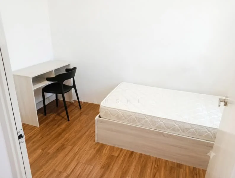 Bedroom features: single bed frame, mattress, wooden flooring, study desk, black chair, white painted walls, built-in wardrobe, natural light from window; style: minimalist.