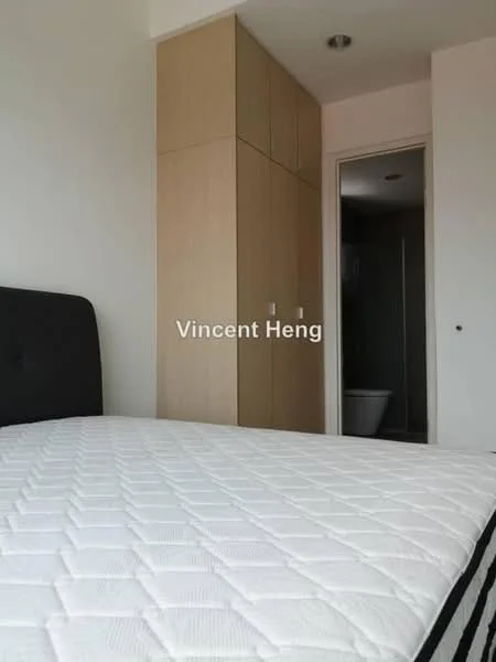 Bedroom features: queen-size bed, black upholstered headboard, white quilted mattress, built-in wardrobe with light wood finish, neutral wall color, recessed ceiling lights, doorway leading to bathroom, visible bathroom fixtures; style: modern.