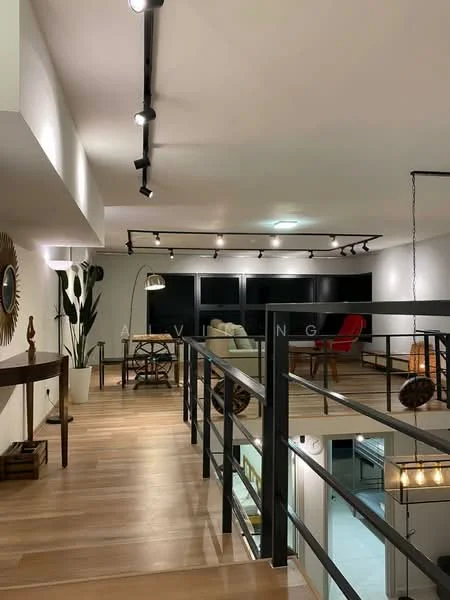 Room features: wooden flooring, track lighting, black railing, large windows, decorative mirror, indoor plants, freestanding lamp, red accent chair, open space layout, neutral wall color; style: modern.
