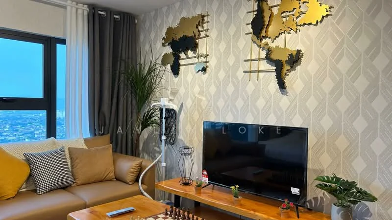 Living features: 3-seater fabric sofa in beige, decorative cushions in various colors, wooden coffee table, chessboard on coffee table, wall-mounted flat-screen TV, decorative wall art with world maps, light-colored wallpaper with geometric pattern, floor-to-ceiling window with city view, indoor plant, sheer curtains, wooden flooring; style: modern; view: city.