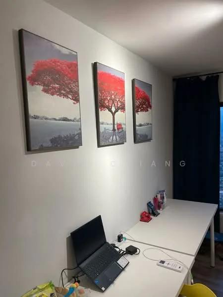 Room features: white painted walls, three framed artworks with red trees, white desk, laptop on desk, stationery items on desk, blue curtains, carpeted flooring; style: modern; view: city.