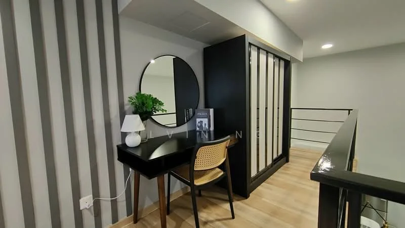 Room features: wooden flooring, grey painted walls, striped accent wall, round mirror, black vanity table, wooden chair, decorative plant, wall-mounted lighting, sliding glass wardrobe, open space design; style: modern.