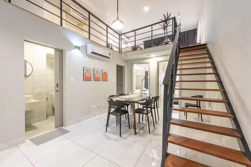 Living features: white painted walls, marble tile flooring, 5-blade ceiling fan with light, dining table for 4, black dining chairs, wall-mounted split AC, staircase with wooden steps and metal railing, decorative wall art, large window with curtains; style: modern. Bathroom features: tile cladding, glass shower enclosure, round mirror, chrome basin mixer, one-piece toilet.